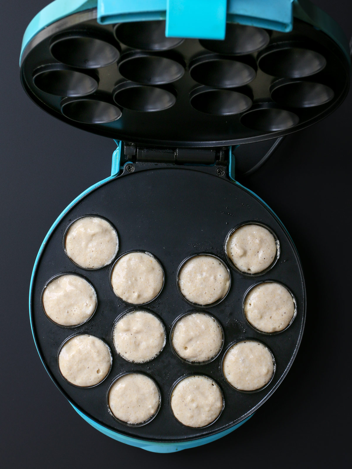aebleskiver batter added to cups.