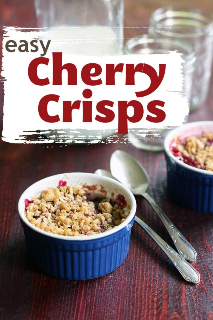 ramekins of Cherry Crisp with spoons