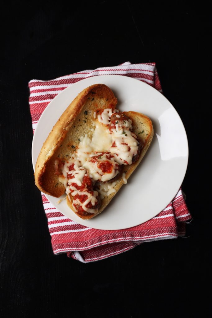 a plate with a Meatball sub