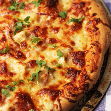 A large BBQ Chicken pizza topped with cilantro