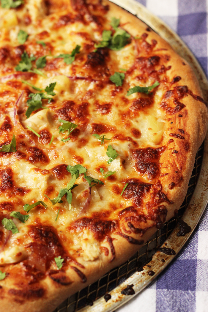 A large BBQ Chicken pizza topped with cilantro