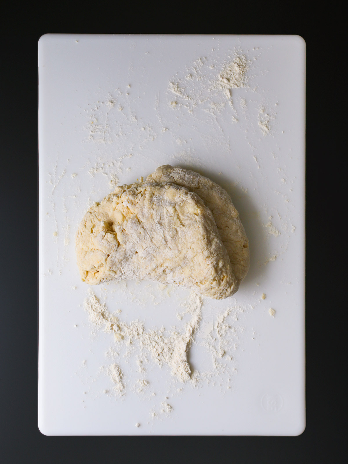 kneading dough on a floured surface.