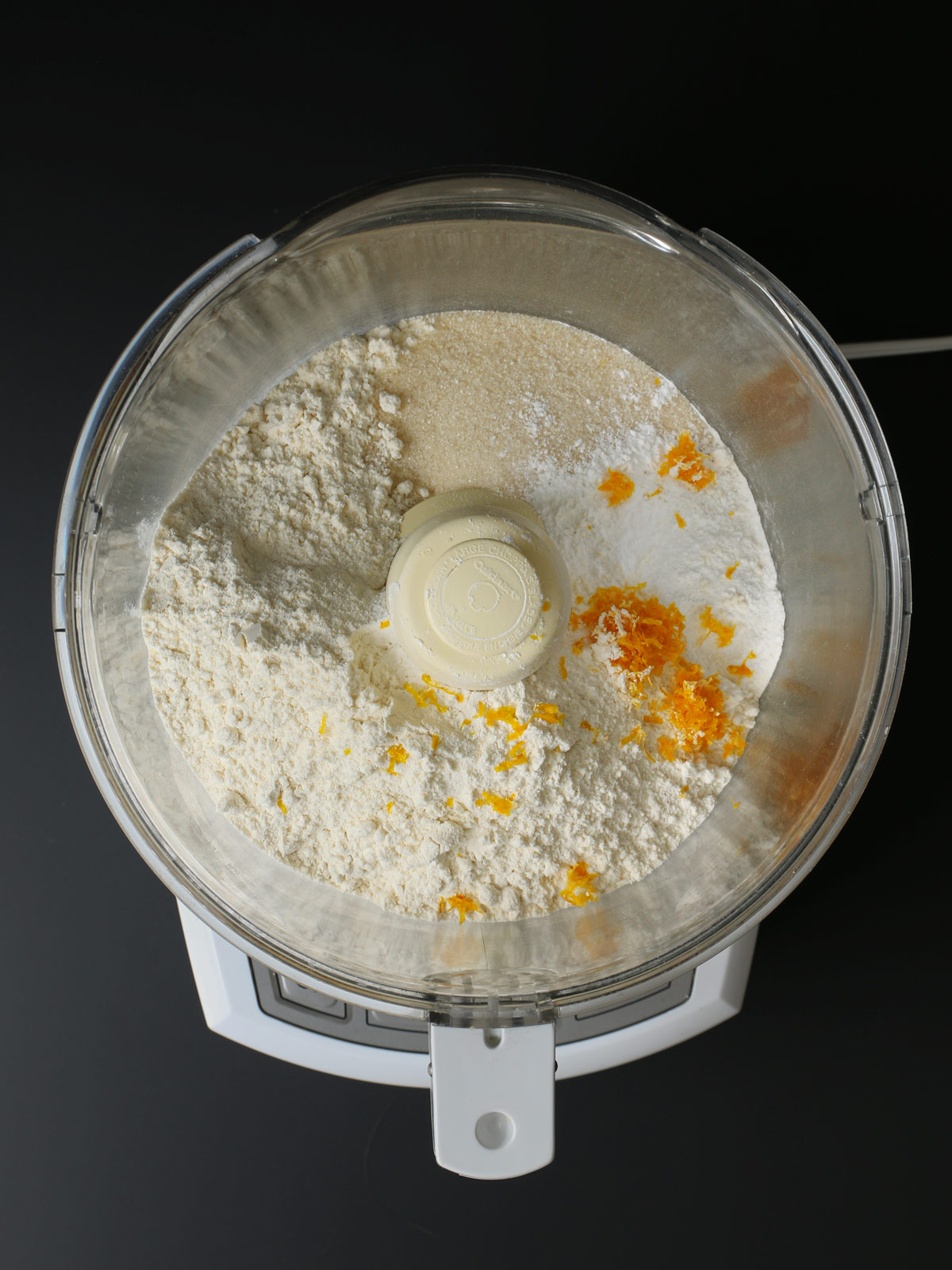 dry ingredients in food processor bowl.