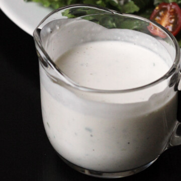 blue cheese dressing in a glass pitcher