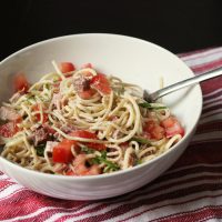 A bowl of creamy noodles and ham