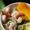 A bowl of shrimp with mango and avocado