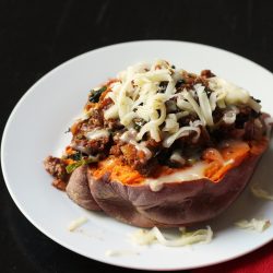 A plate of food, with stuffed Potato