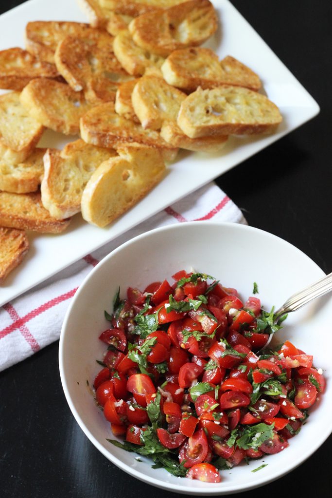 A plate of dippers with Tomato salad
