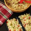 bowl of bowtie pasta salad with meal prep boxes