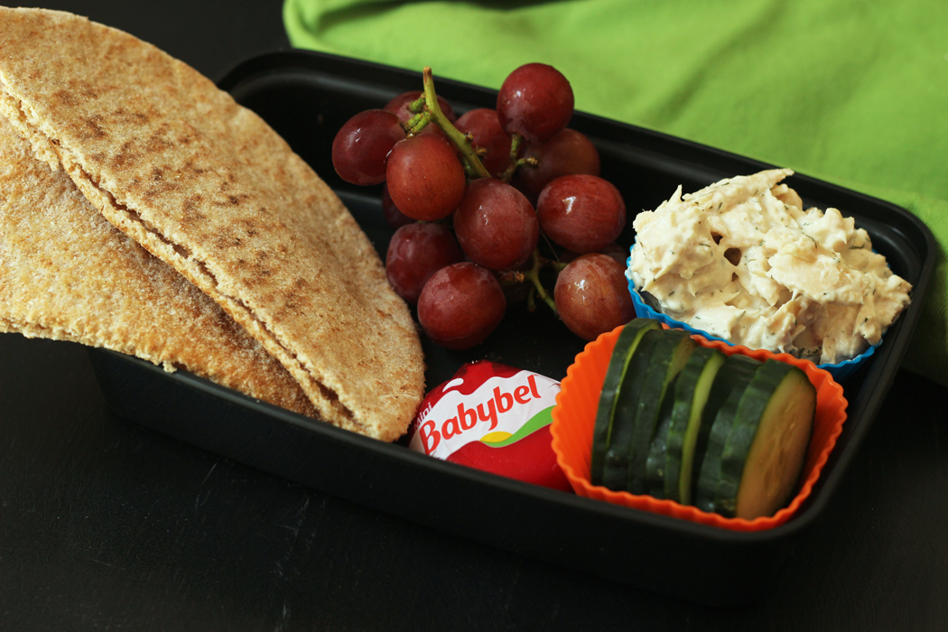 Tuna Pita pocket packed for lunch with fruit and cheese