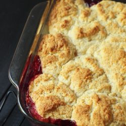 fruit cobbler in glass baking pan