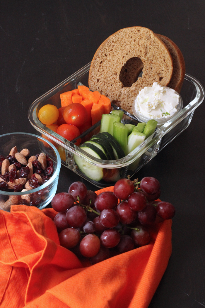 bagel and veggies in a container