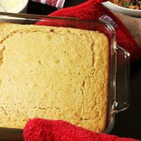 A close up of pan of cornbread on a table