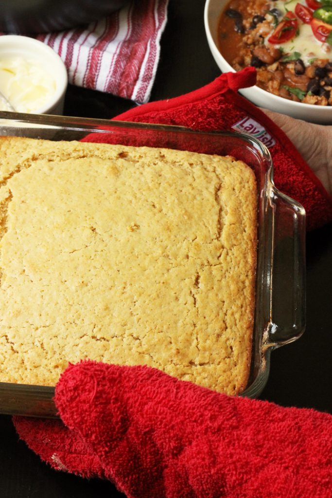 A close up of pan of cornbread on a table