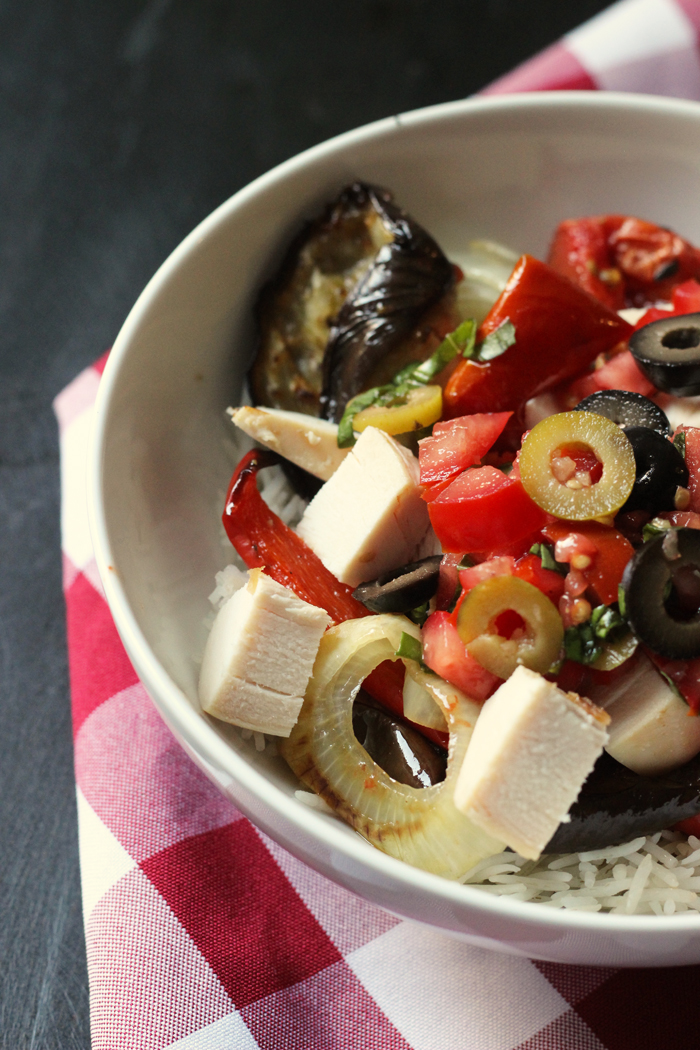 A bowl of Chicken, olives, and veggies