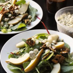 two plates of pear and blue cheese salad