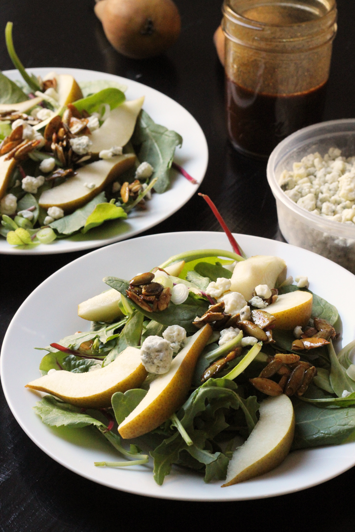 two plates of pear and blue cheese salad