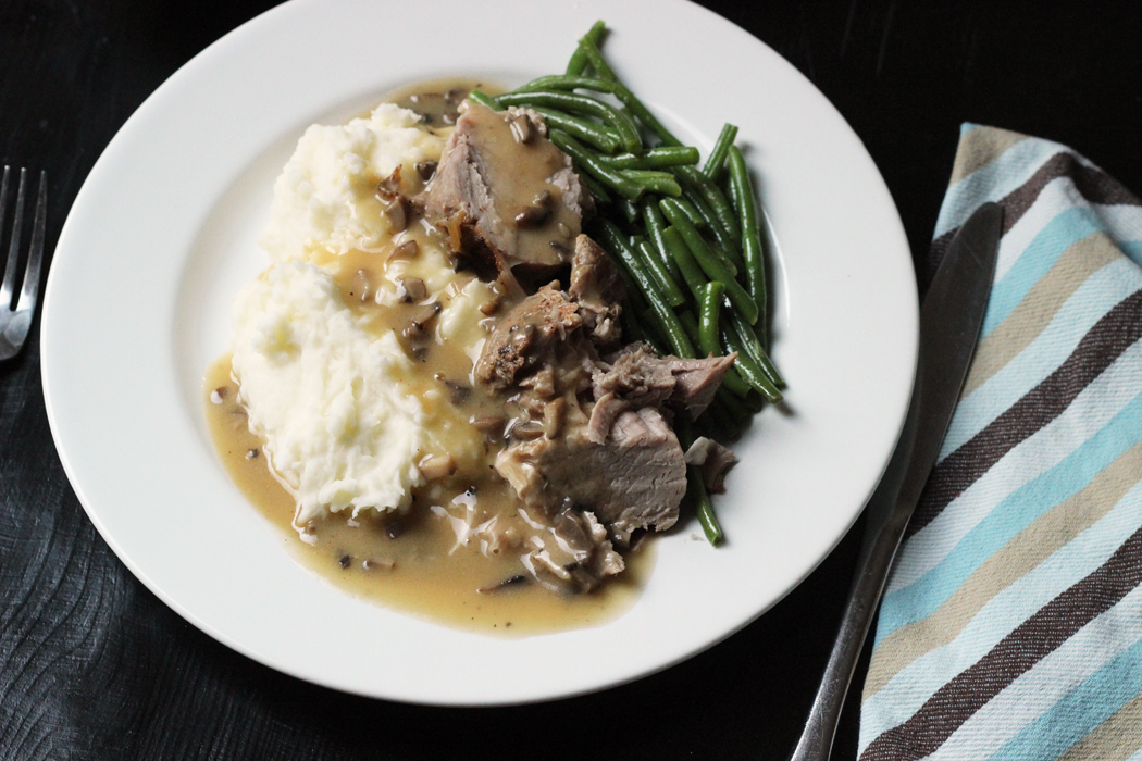 A plate of food on a table, with Pork