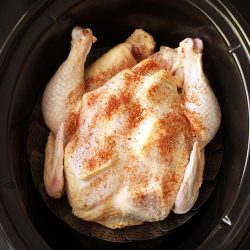 prepped chicken on steamer in slow cooker