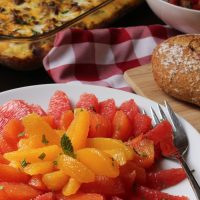 citrus salad, bread, and breakfast casserole
