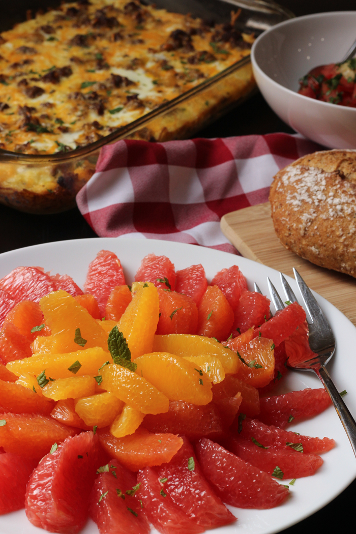 citrus salad, bread, and breakfast casserole