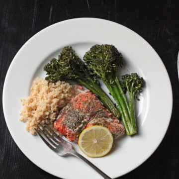 A plate of food with broccoli and Salmon