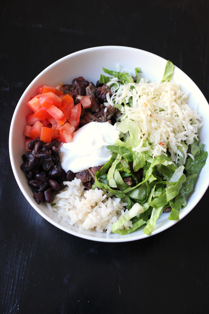 bowl of beans and rice and other fixings