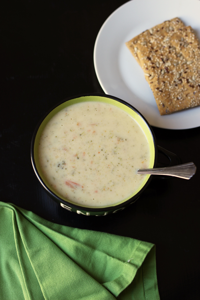 bowl of broccoli cheese soup and crackers