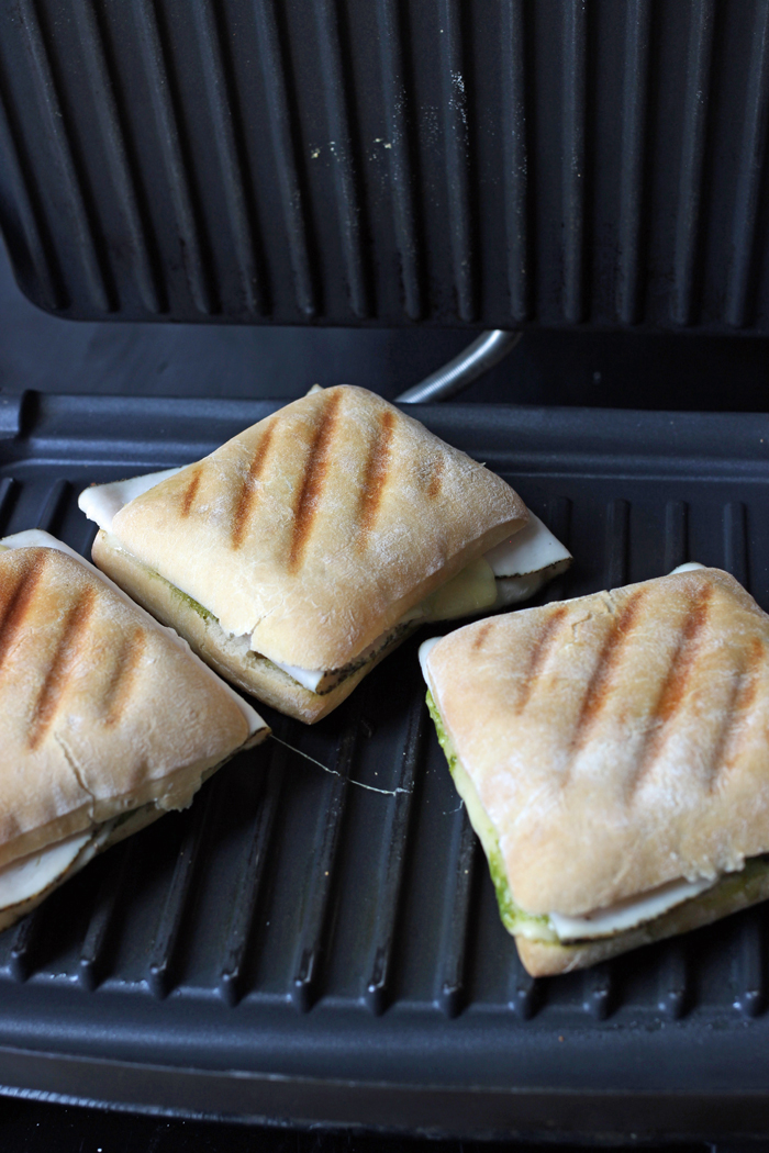 turkey sandwiches with grill marks on the panini press