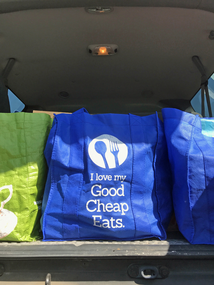 grocery bags in back seat of car