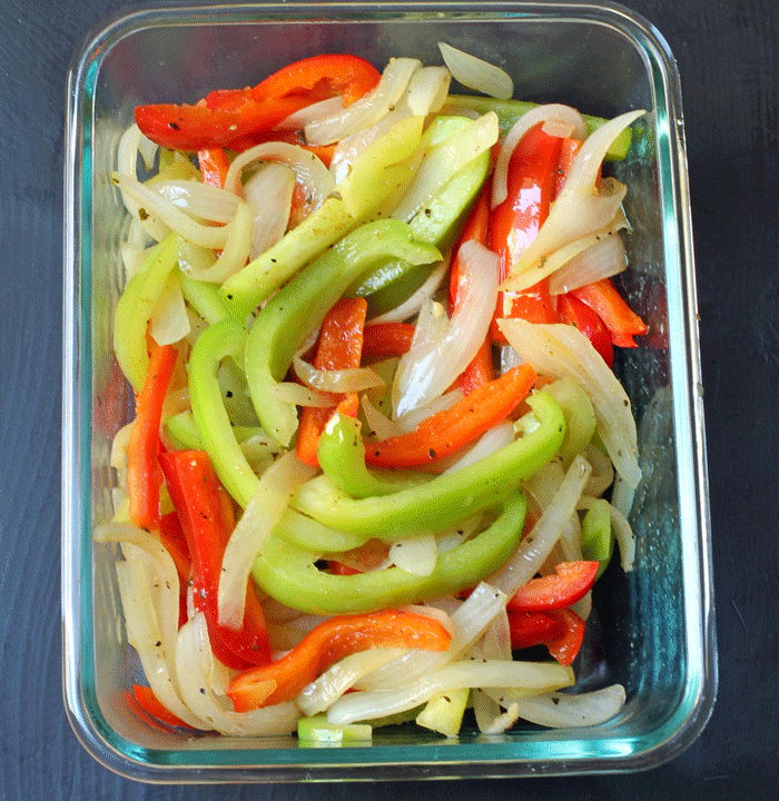 cooked fajita vegetables in glass dish