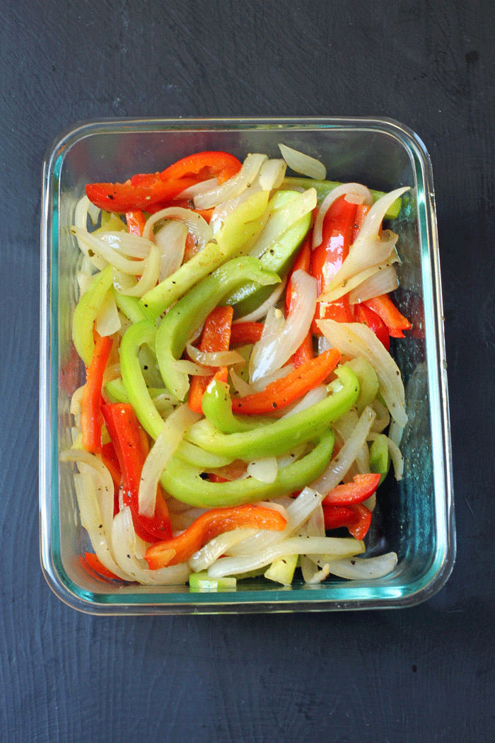 cooked fajita vegetables in glass dish