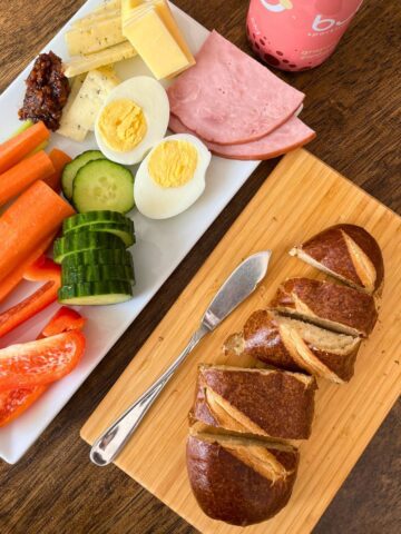 snacky lunch on platters on table.