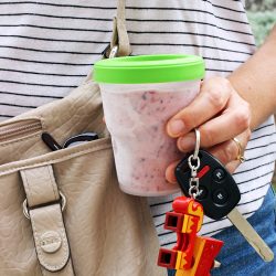 woman holding keys and frozen smoothie