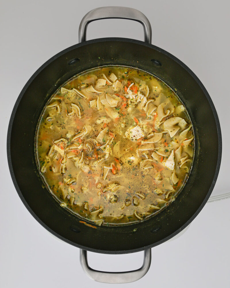 chicken noodle soup in a pot.