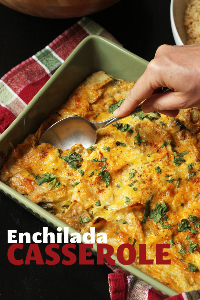 A person holding a spoon, with Enchilada casserole