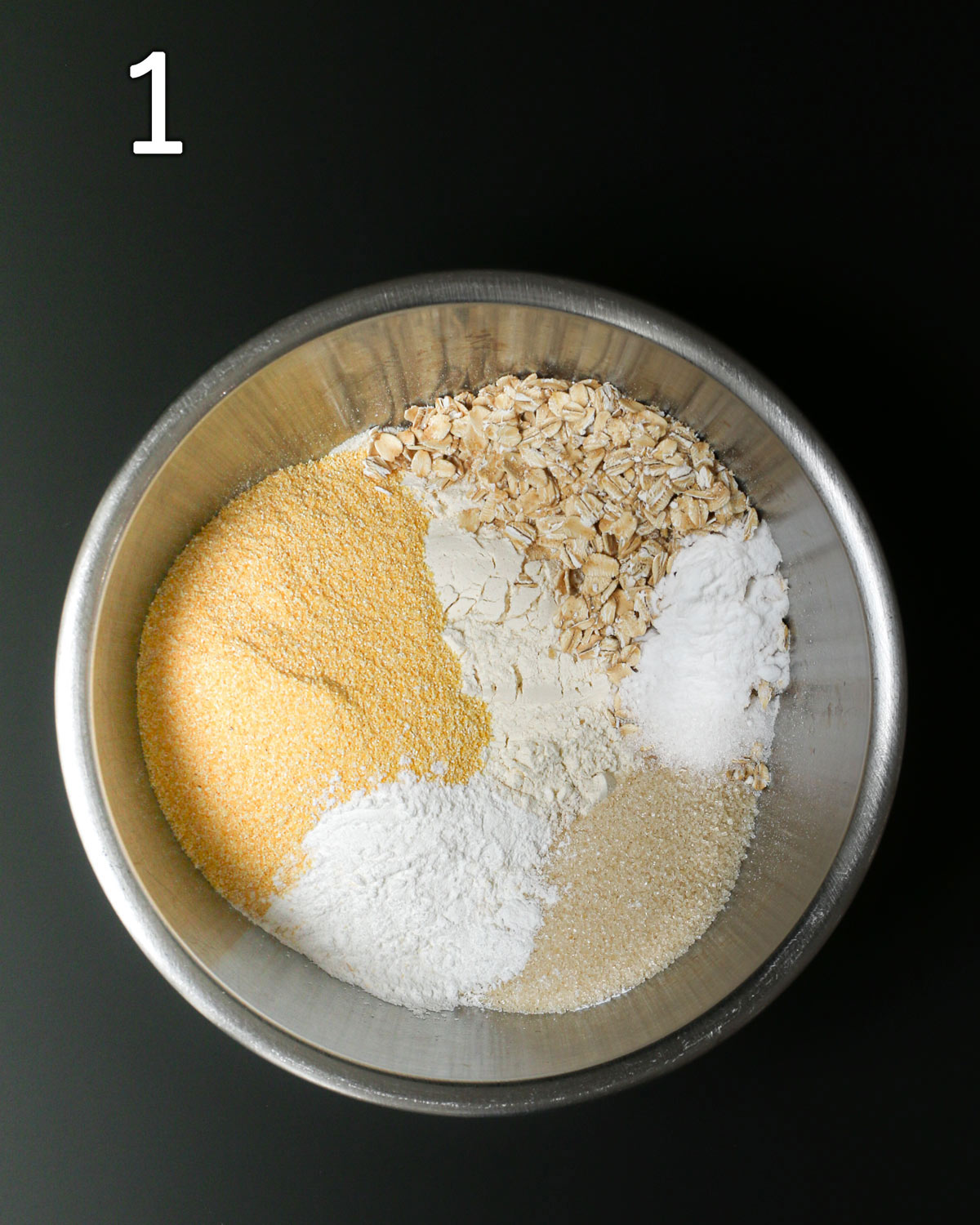 dry ingredients placed in a large metal bowl.