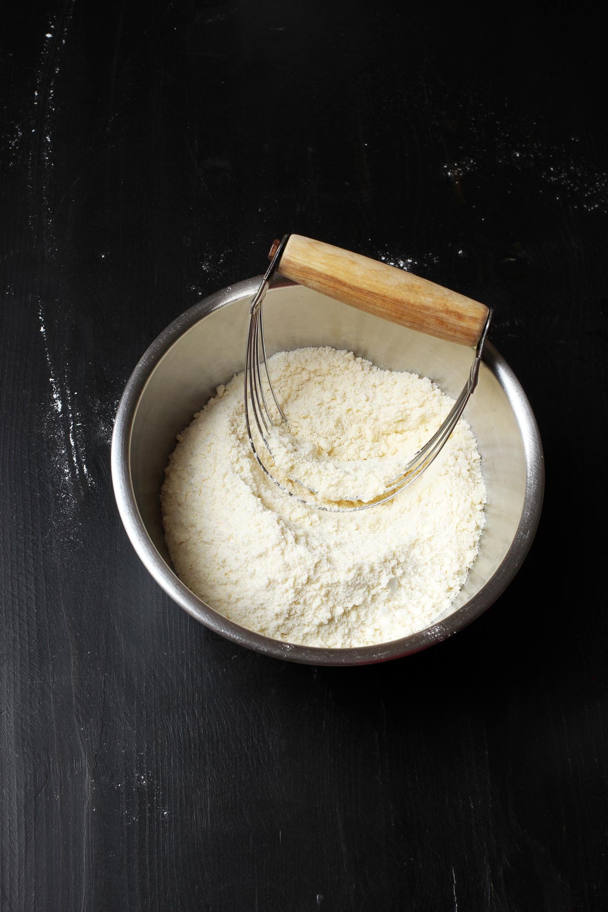 crumbs and pastry blender in bowl