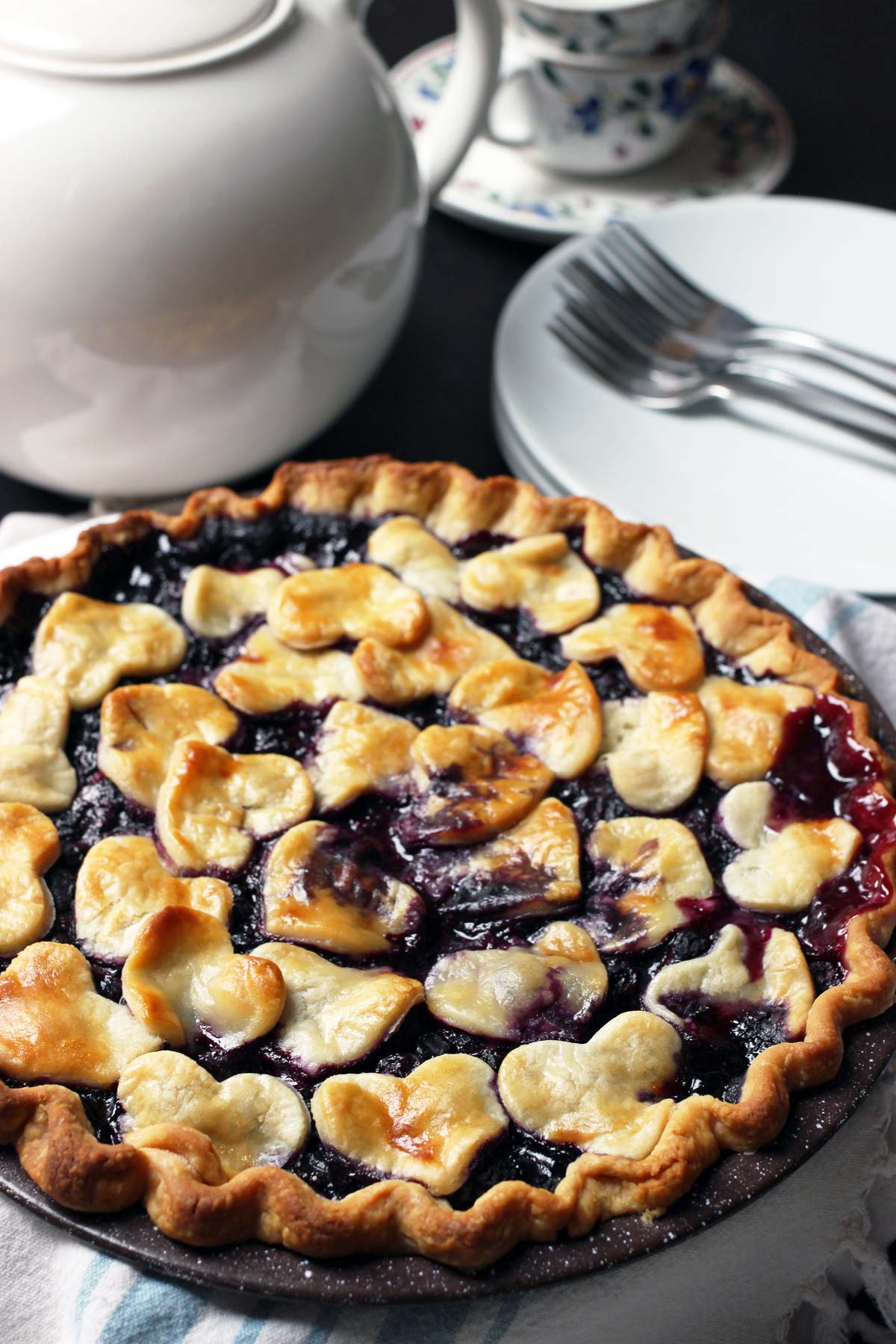 whole blueberry pie on table