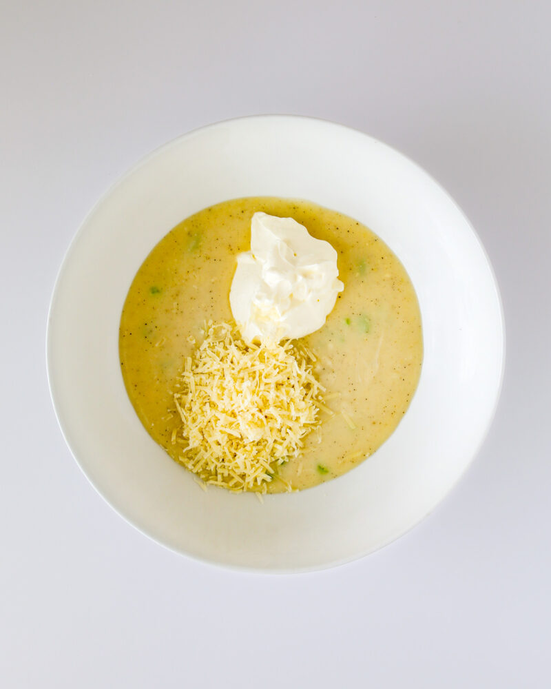 white sauce, sour cream, and cheese in mixing bowl.