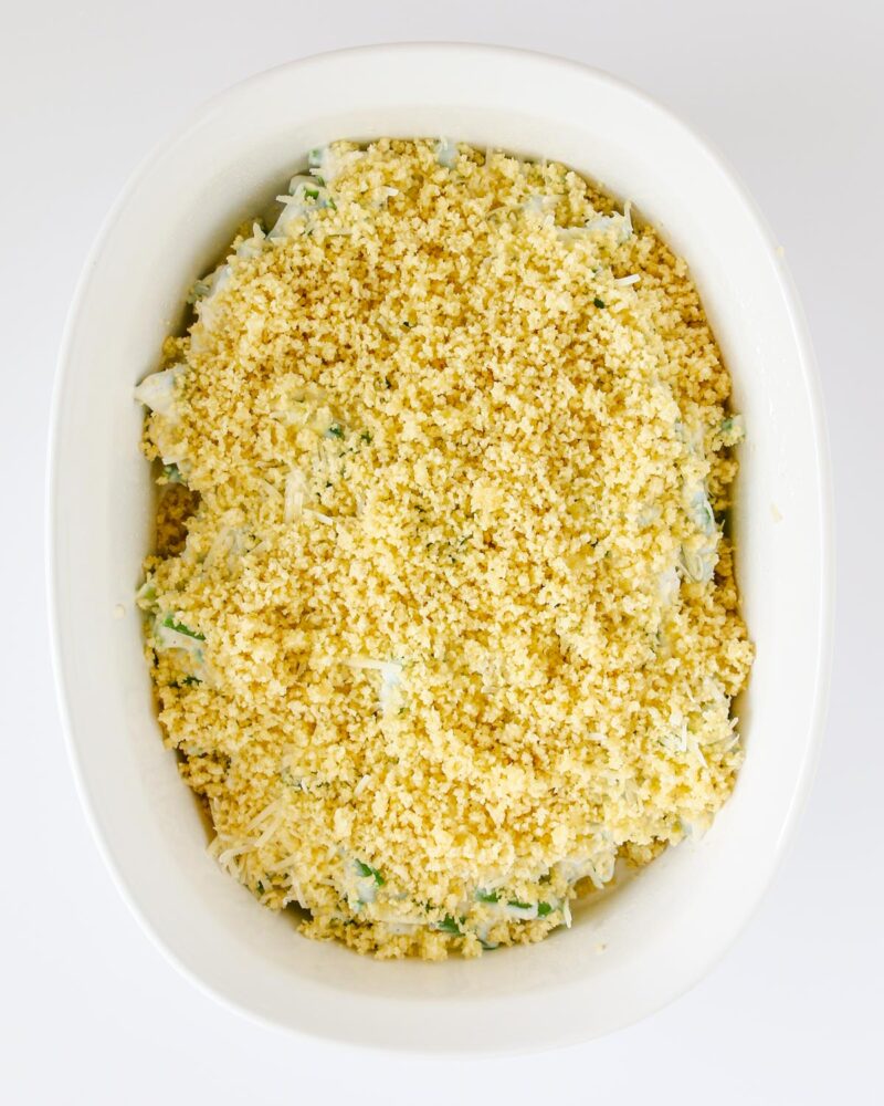 cheese and bread crumbs added to topping of green bean mixture in baking dish.
