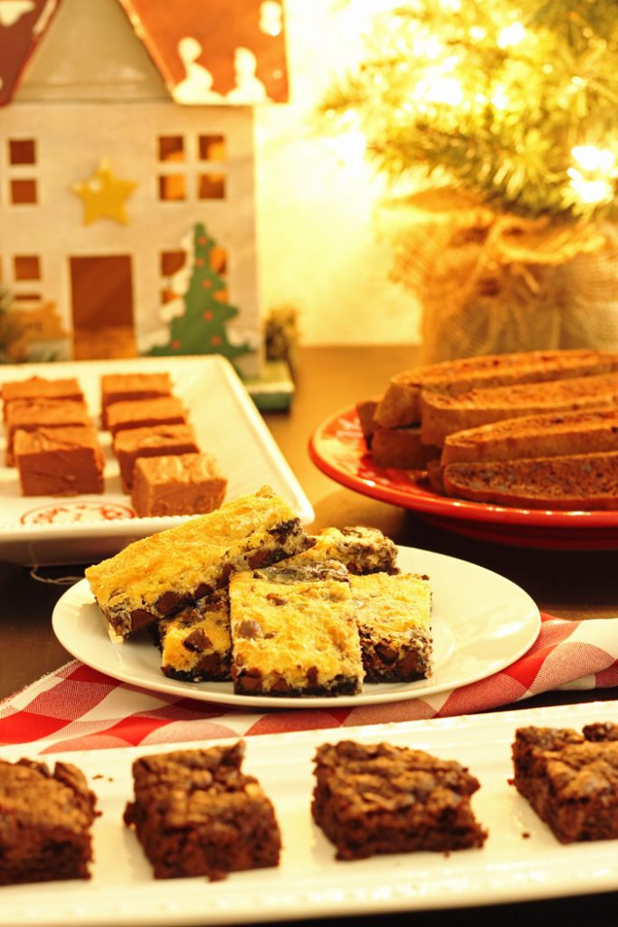 A bunch of different types of cookies on plates