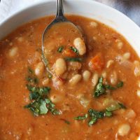spoonful of soup resting on side of the bowl