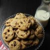 chocolate chip cookies on tray with milk carafe and glasses