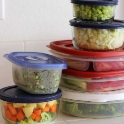 chopped vegetables in stacked storage boxes