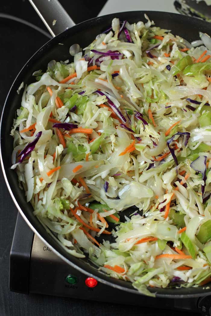 chow mein vegetables cooking in skillet