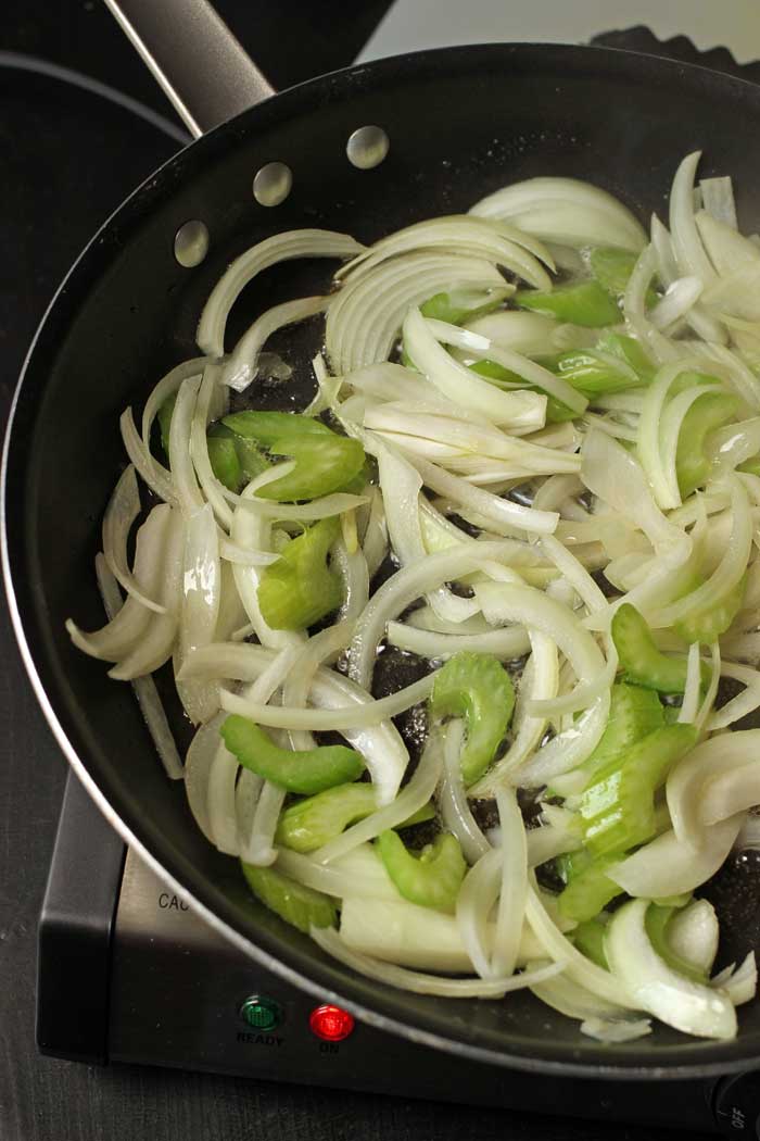 celery and onion cooking in skillet