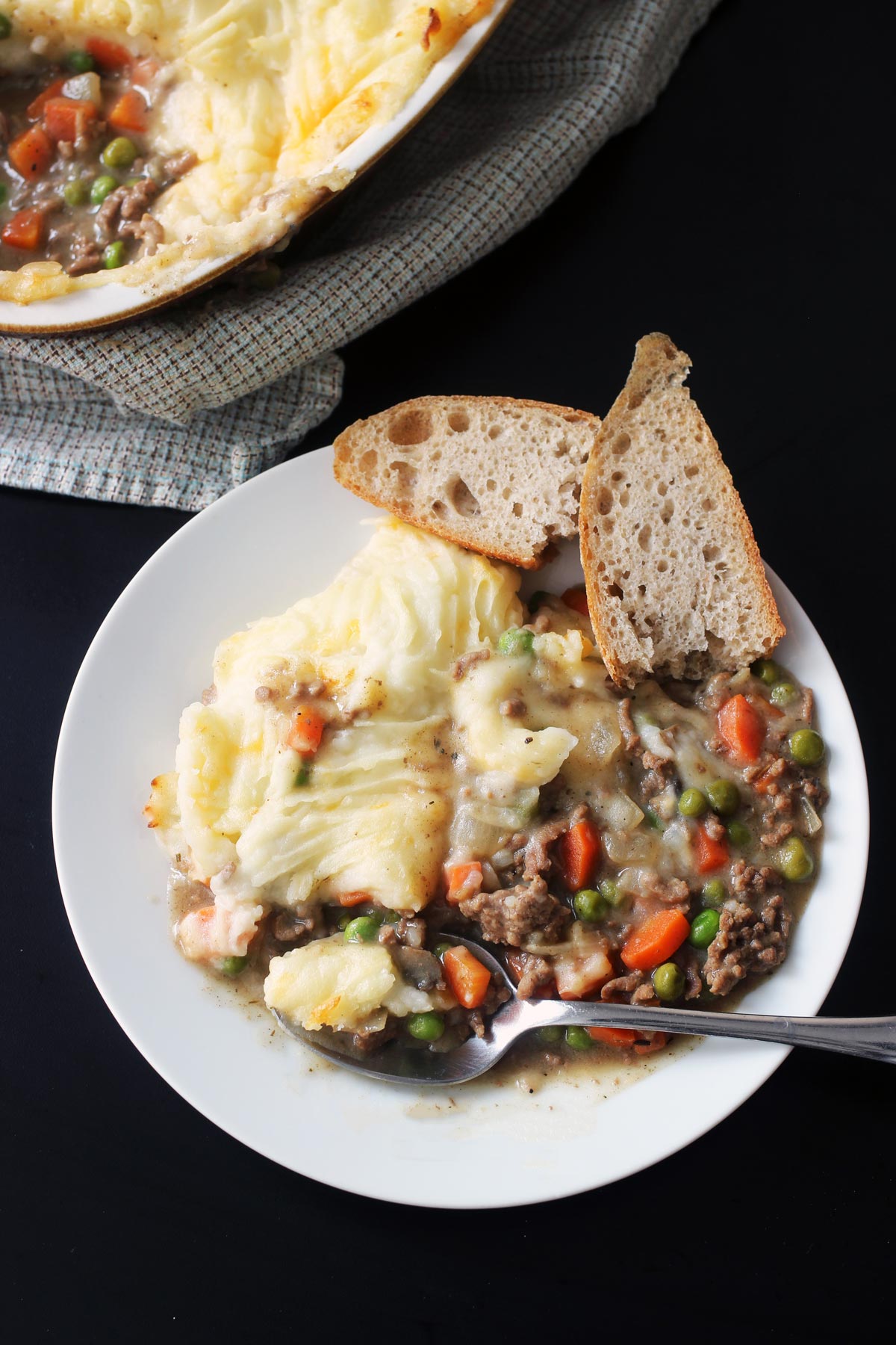 plate of shepherd's pie with bread