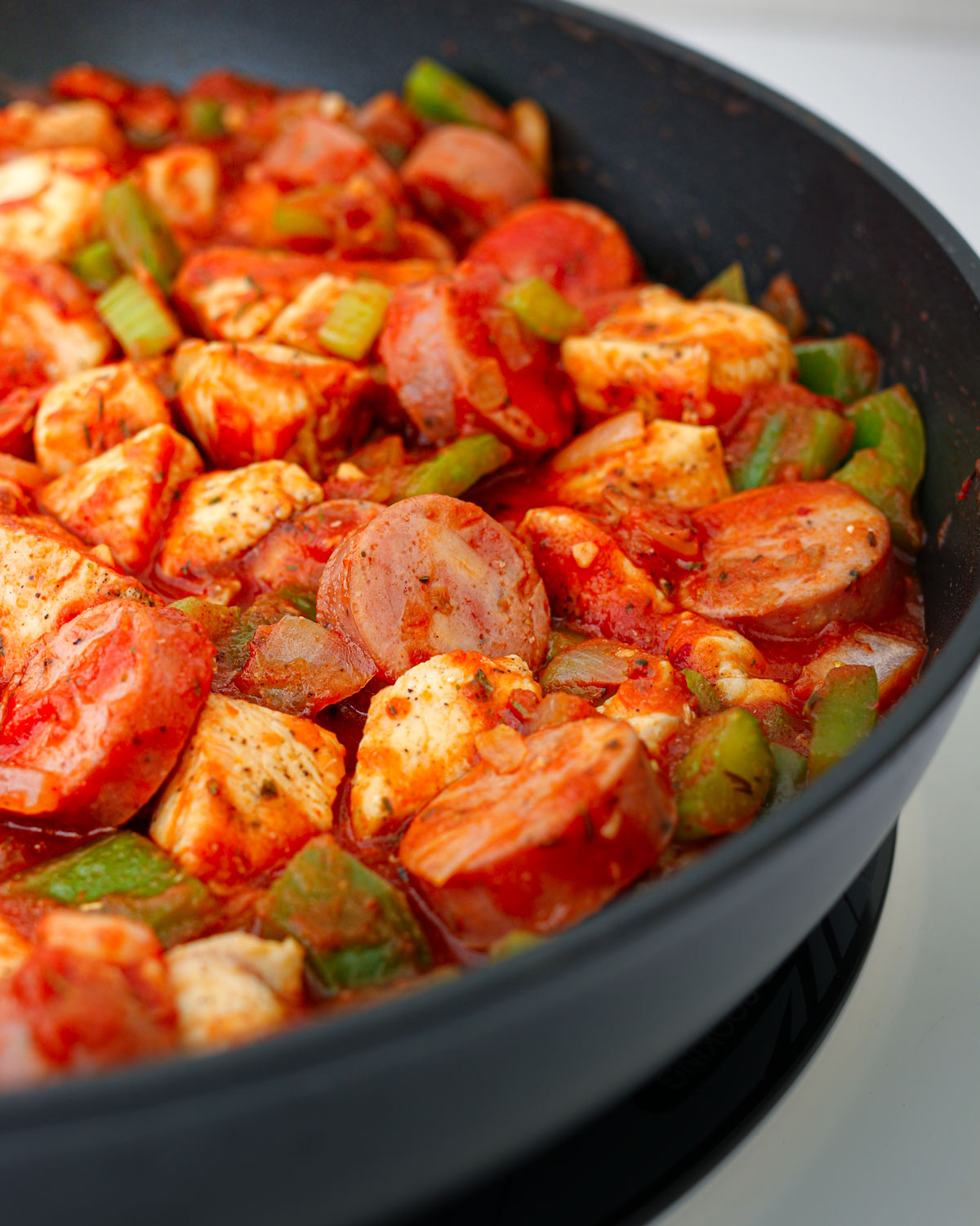 jambalaya meat mixture in skillet.