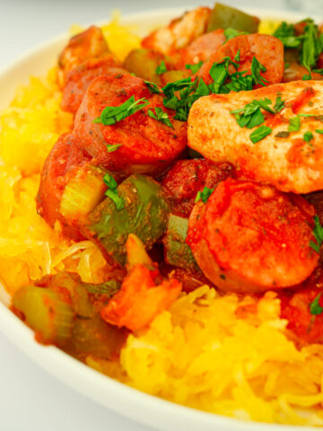 side shot of jambalaya on a bed of spaghetti squash.